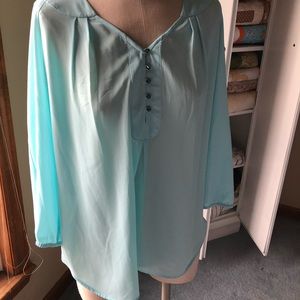 Cute, year round top. Beautiful blue color.